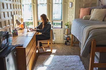 student in dorm room